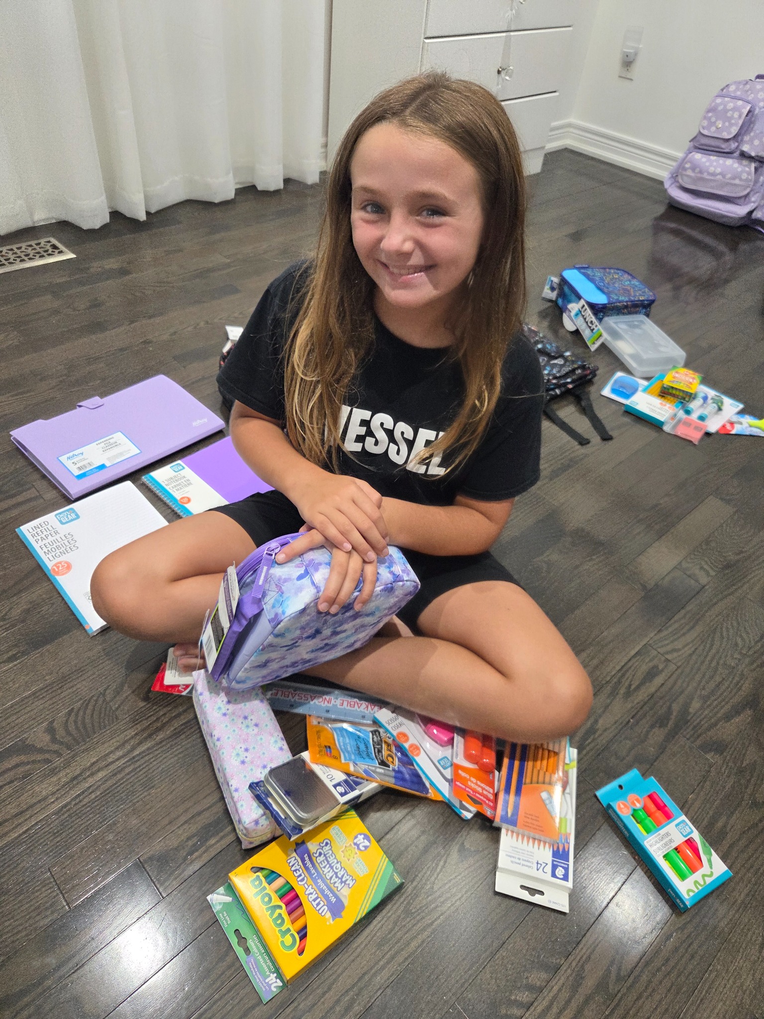 Jazmyn preparing school supplies for backpacks