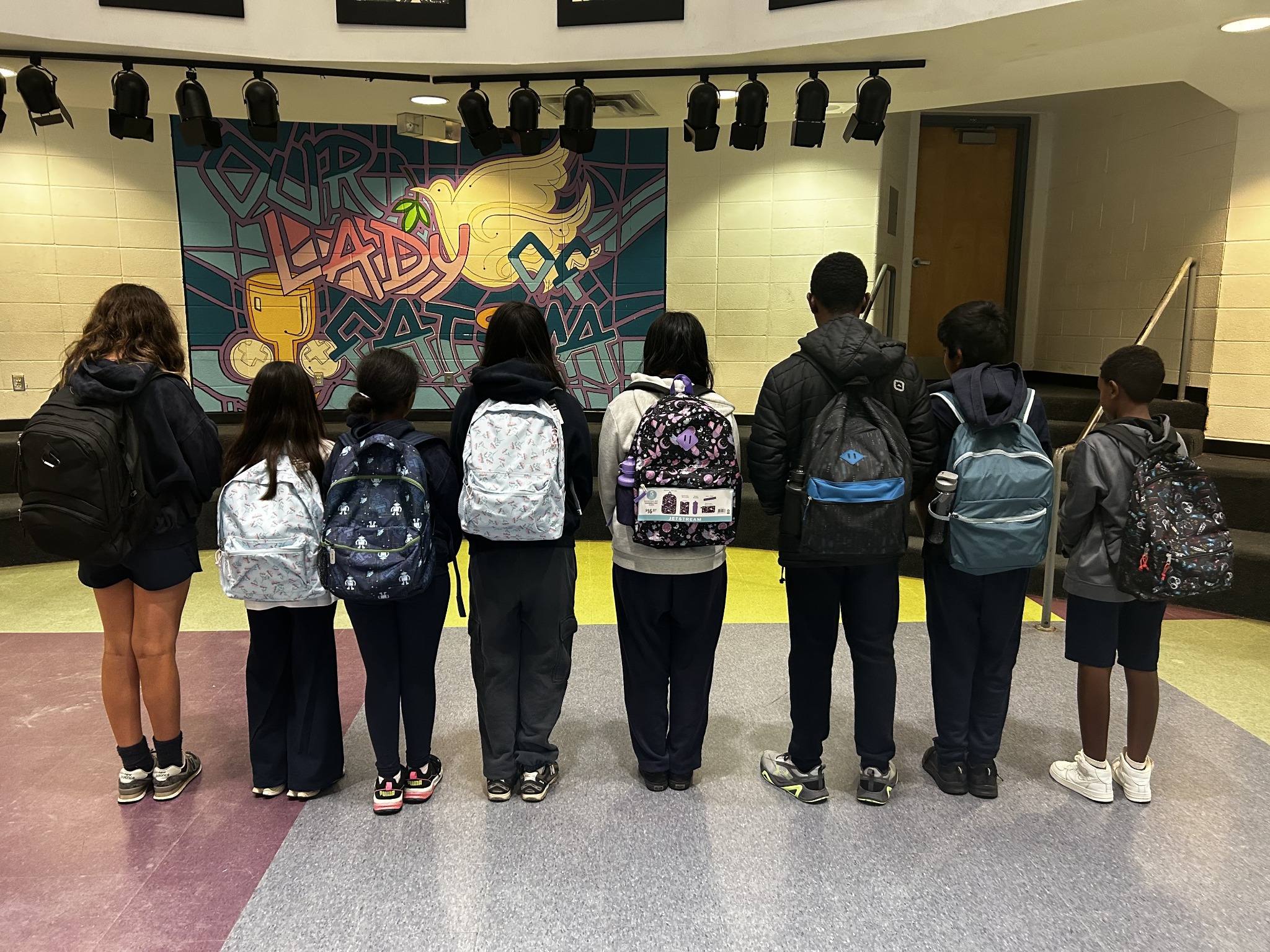 Students with donated backpacks