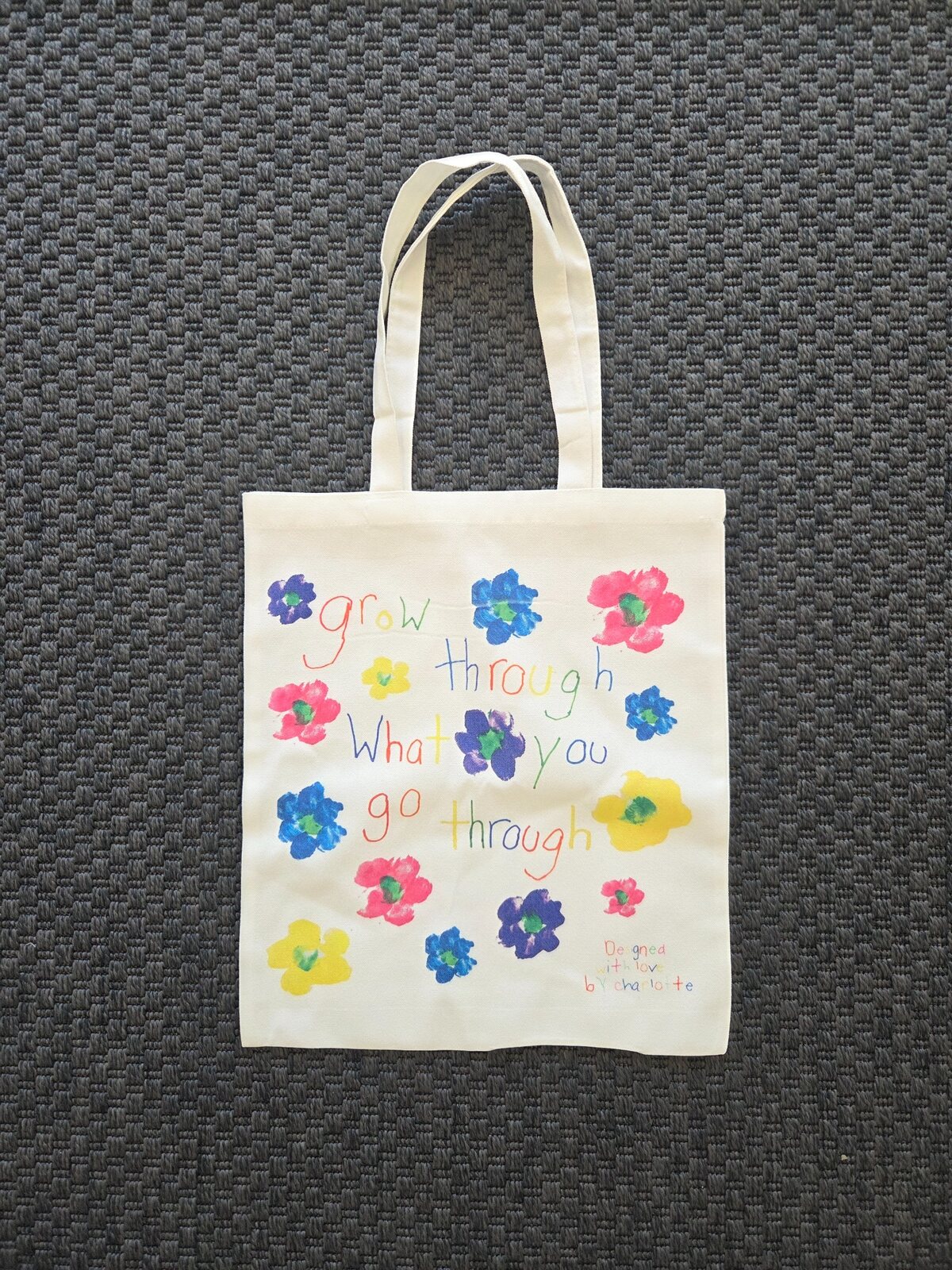 The colourful Grow Through What You Go Through tote designed by Charlotte