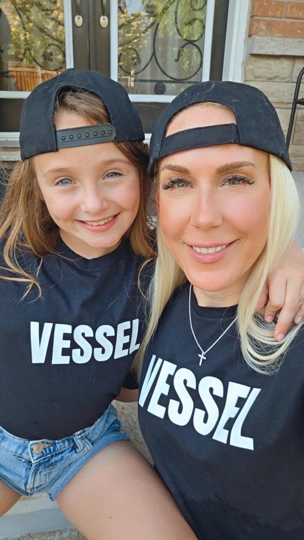 Jennifer and her daughter Jazmyn wearing Vessel shirts