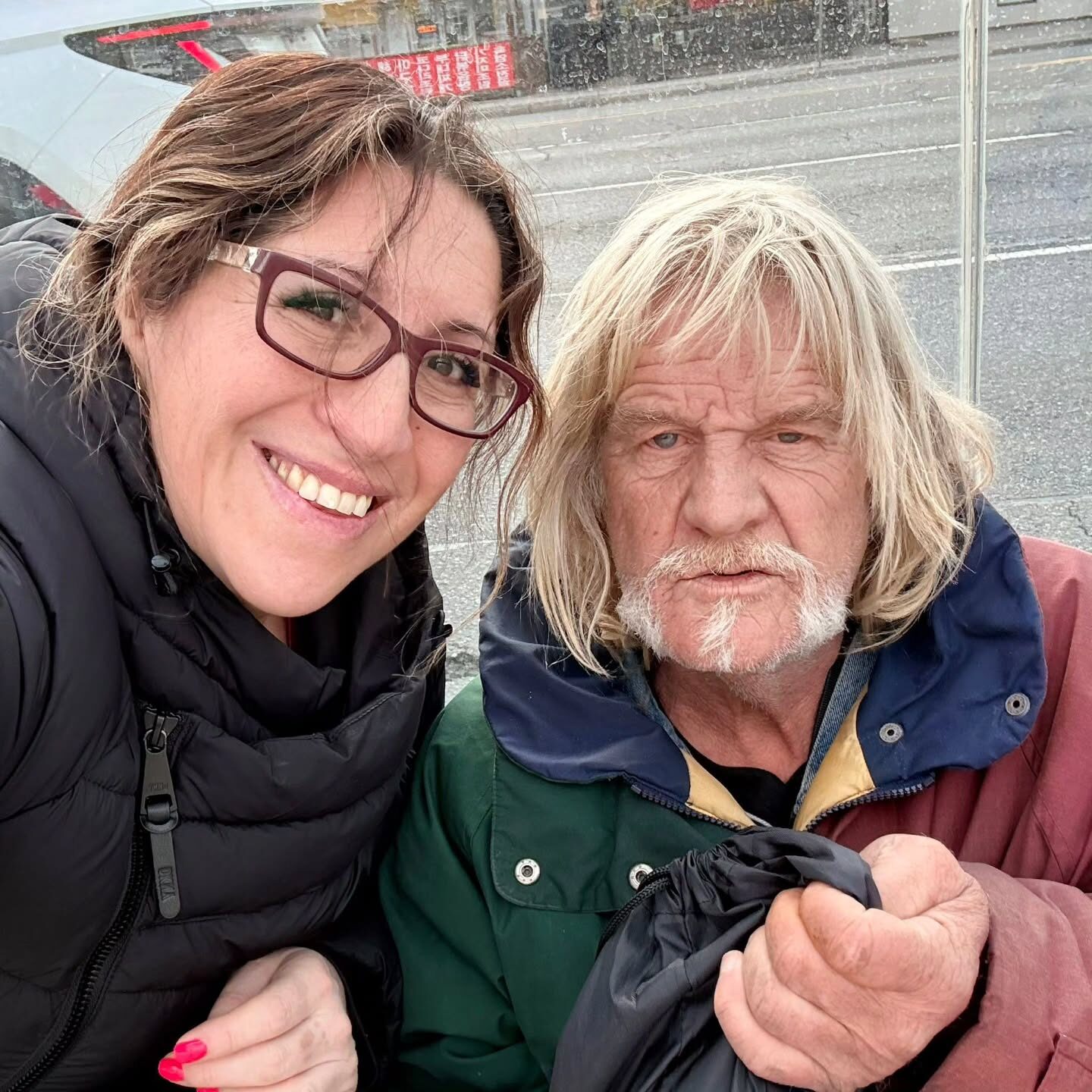 A volunteer sharing a moment of friendship during outreach